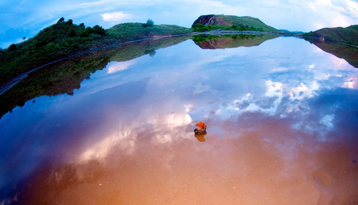 Natural salt pond on Salt Island British Virgin Islands reflecting clouds and sky