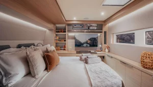 Spacious cabin on Almosta Road with large bed, shelving, and windows