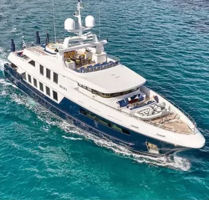 Luxury motor yacht TIMBUKTU cruising through turquoise waters in Greece