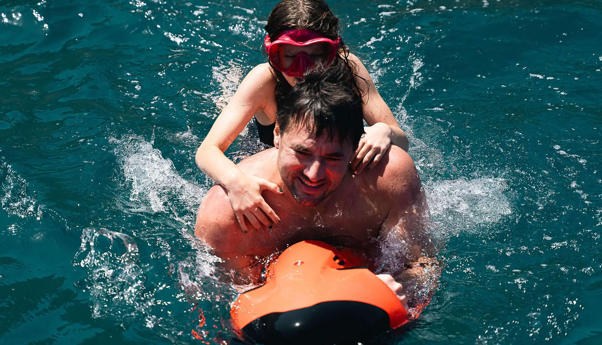 Guests enjoying water sports with a Seabob on a captain-only yacht charter