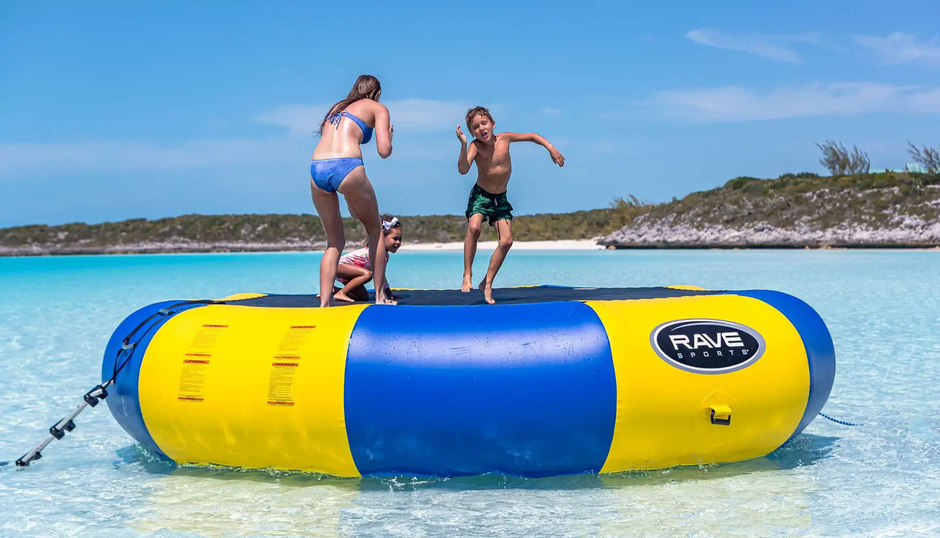 Children enjoying safe water fun during a family yacht charter in the Caribbean