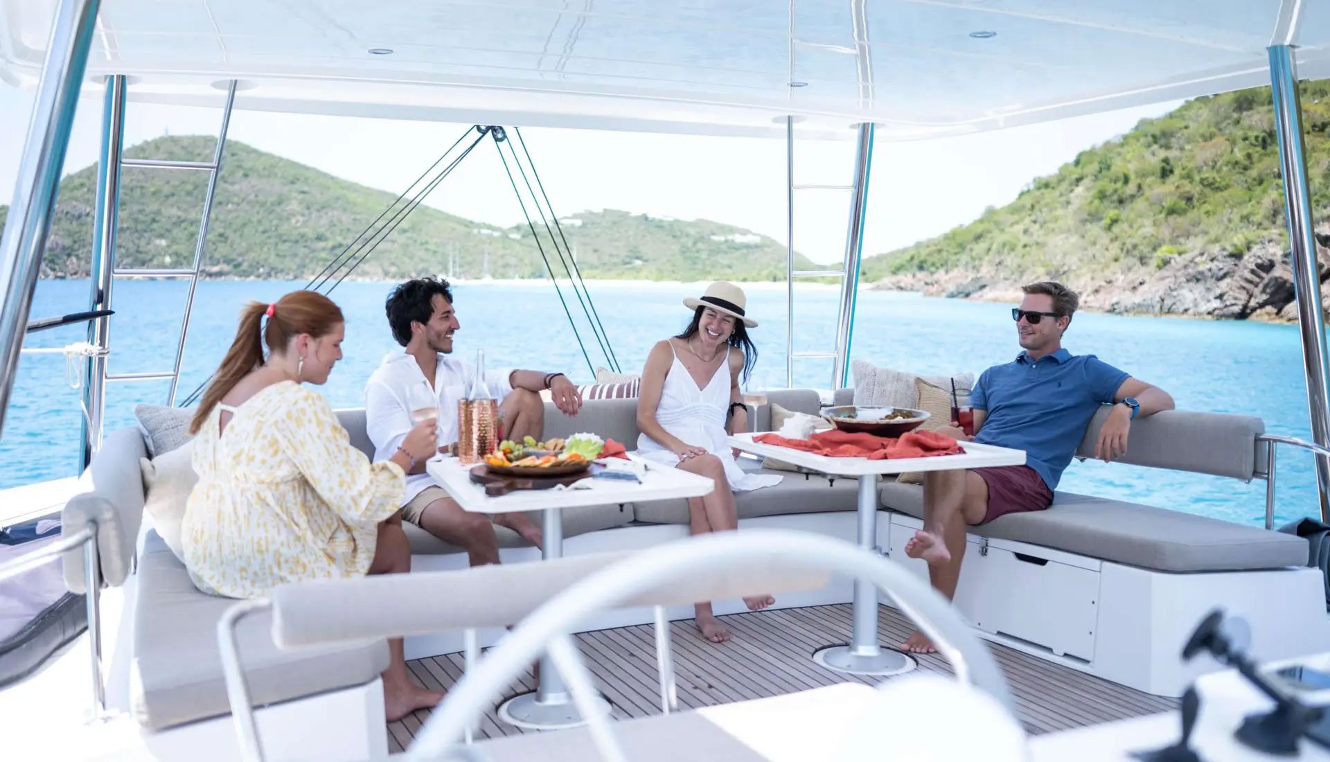 Group enjoying a casual dining experience on the deck of a yacht
