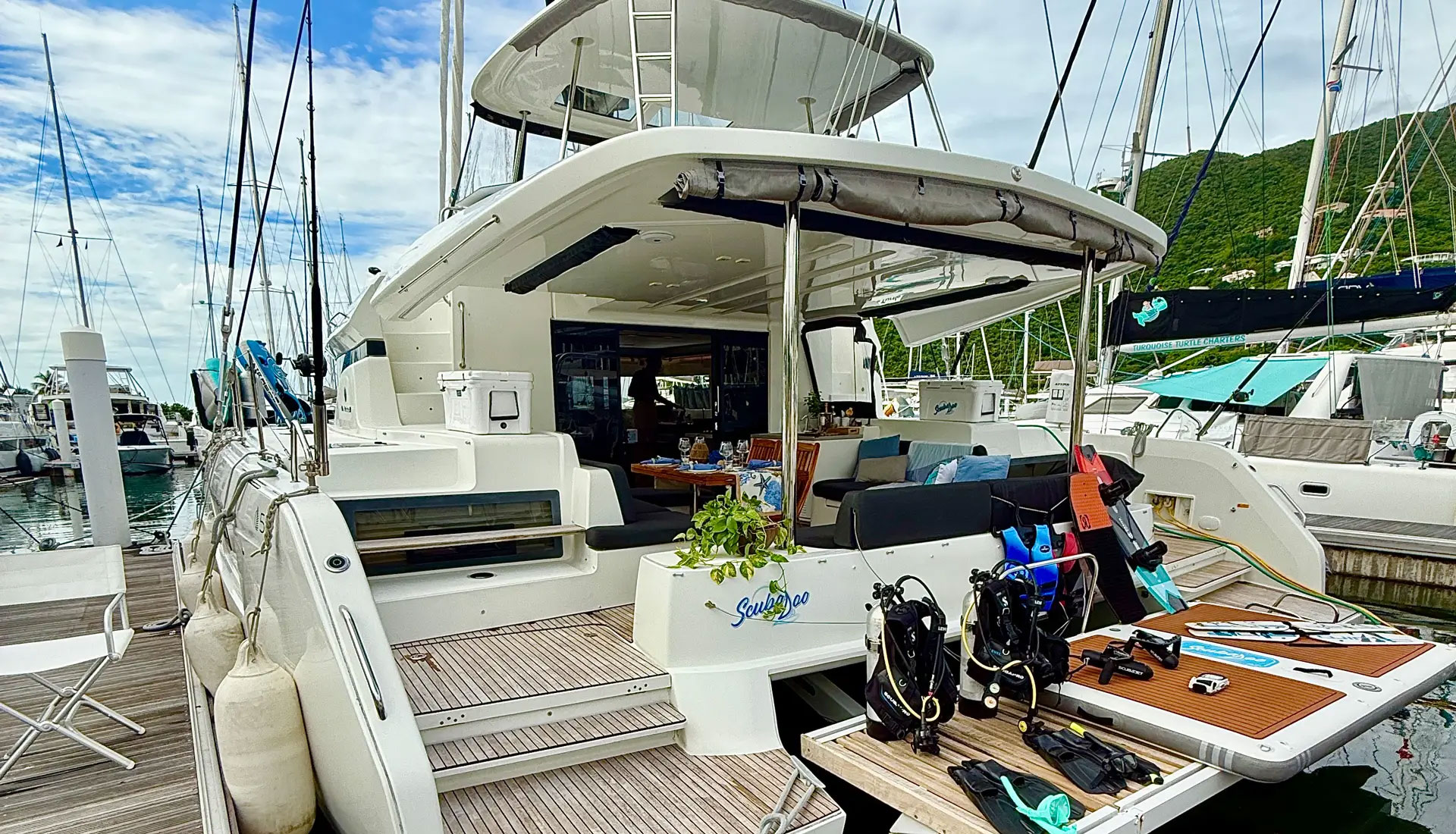 SCUBA diving gear prepared on the stern of a luxury yacht for guests.
