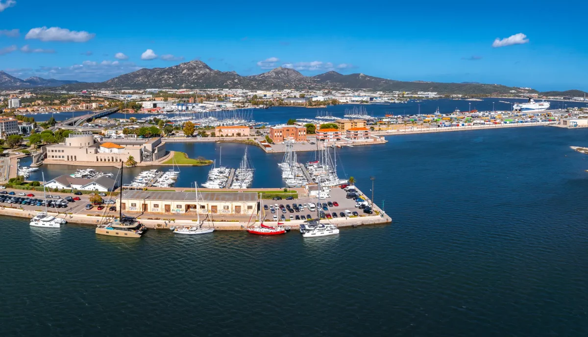 Olbia marina aerial view with yachts waterfront and mountains Sardinia