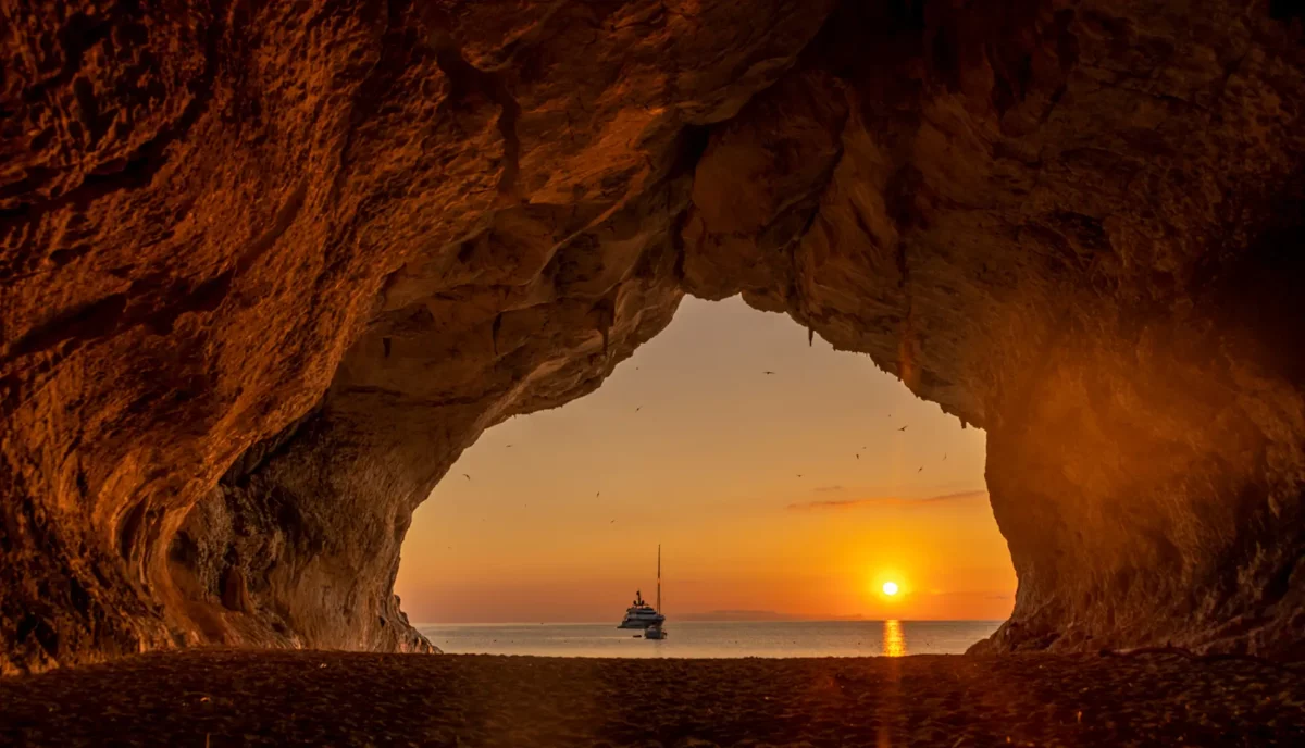 Sardinia Italy yacht charter sunset sailing Cala Luna cave Mediterranean