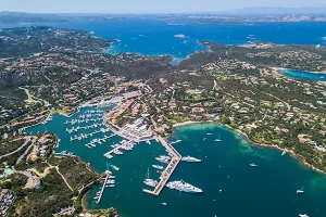 Aerial view of Porto Cervo luxury marina in Sardinia Italy with superyachts in Costa Smeralda turquoise waters
