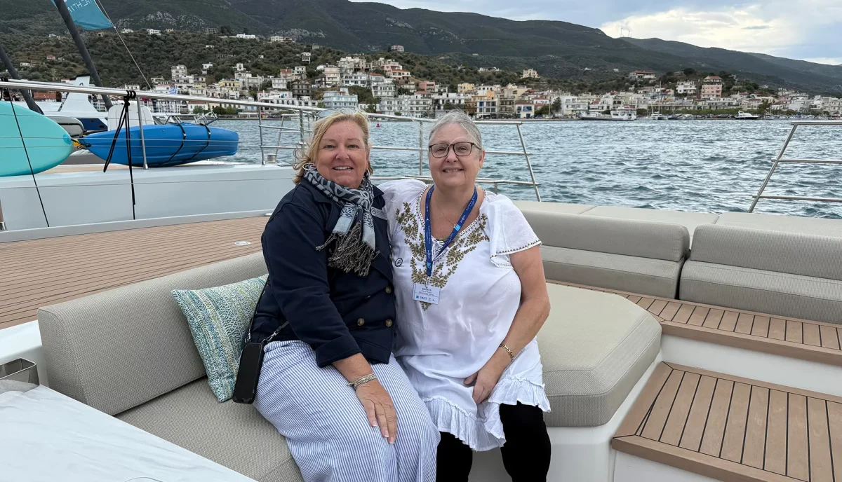 Yacht brokers at Greek Mediterranean yacht show inspecting charter catamarans