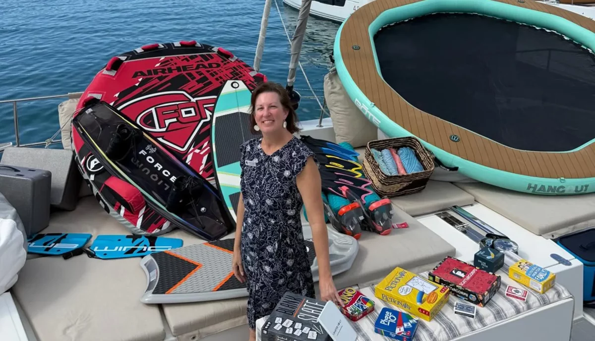Epic team member evaluating charter catamaran water toys and recreation equipment