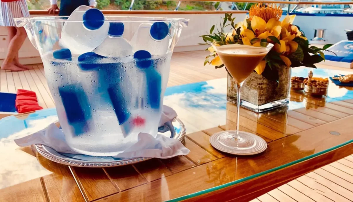 Colorful cocktails and beverages served on luxury yacht deck with ocean view