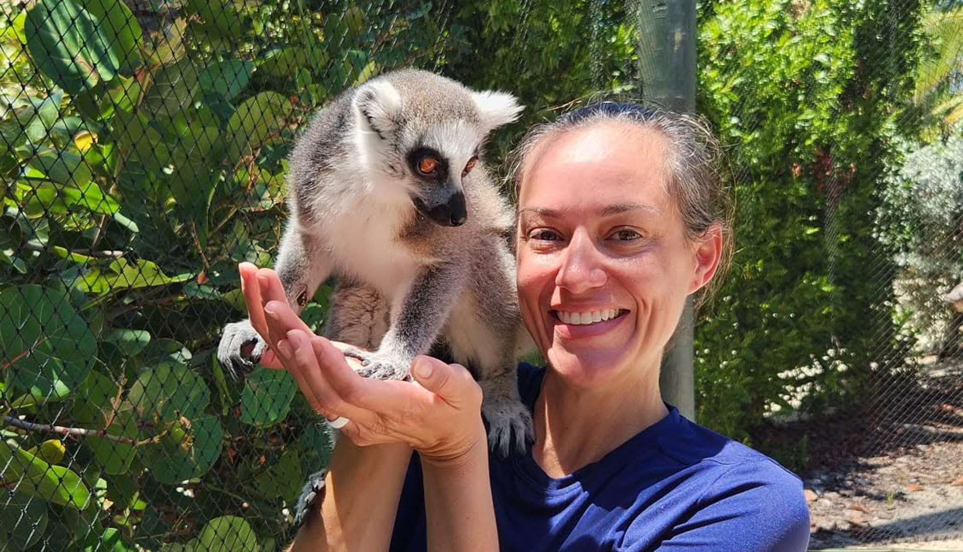 Guest with a lemur during a Necker Island tour, Virgin Gorda BVI
