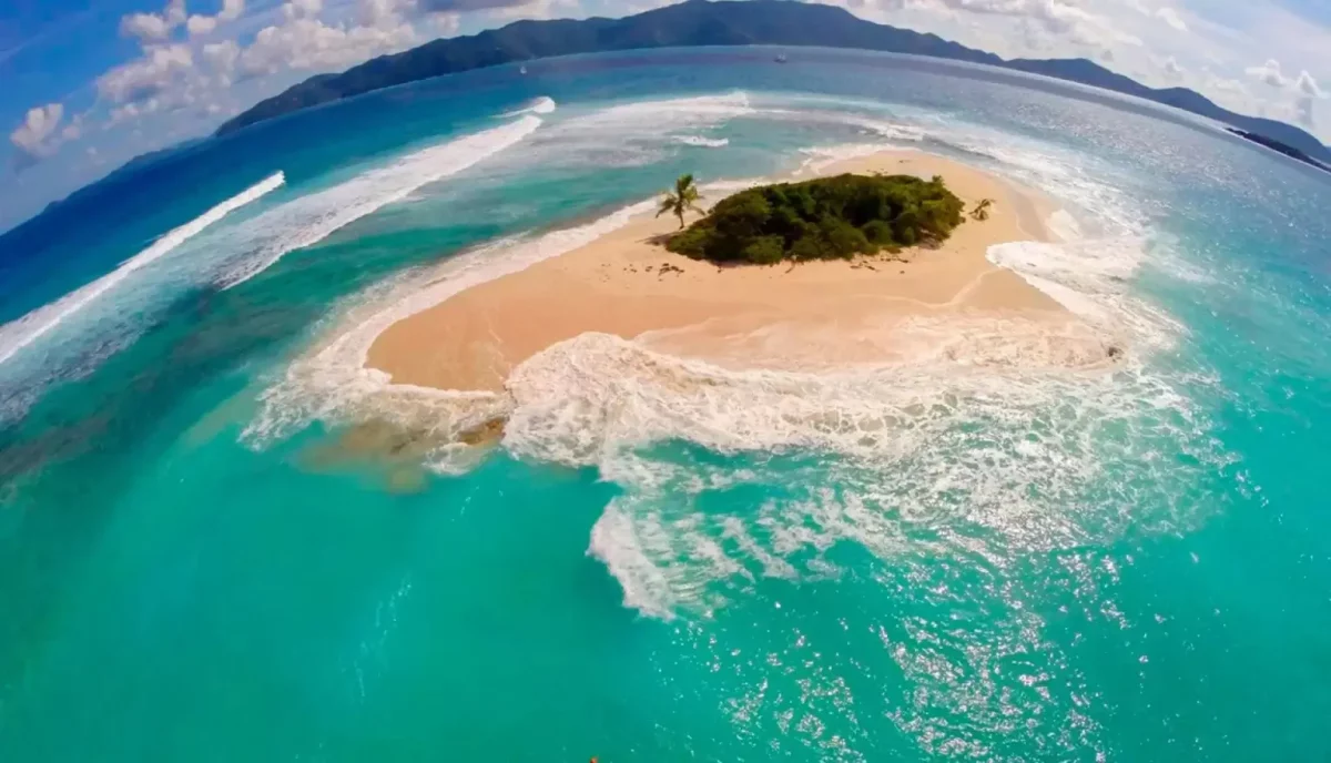 Aerial view of Sandy Spit island near Jost Van Dyke in the British Virgin Islands surrounded by turquoise water