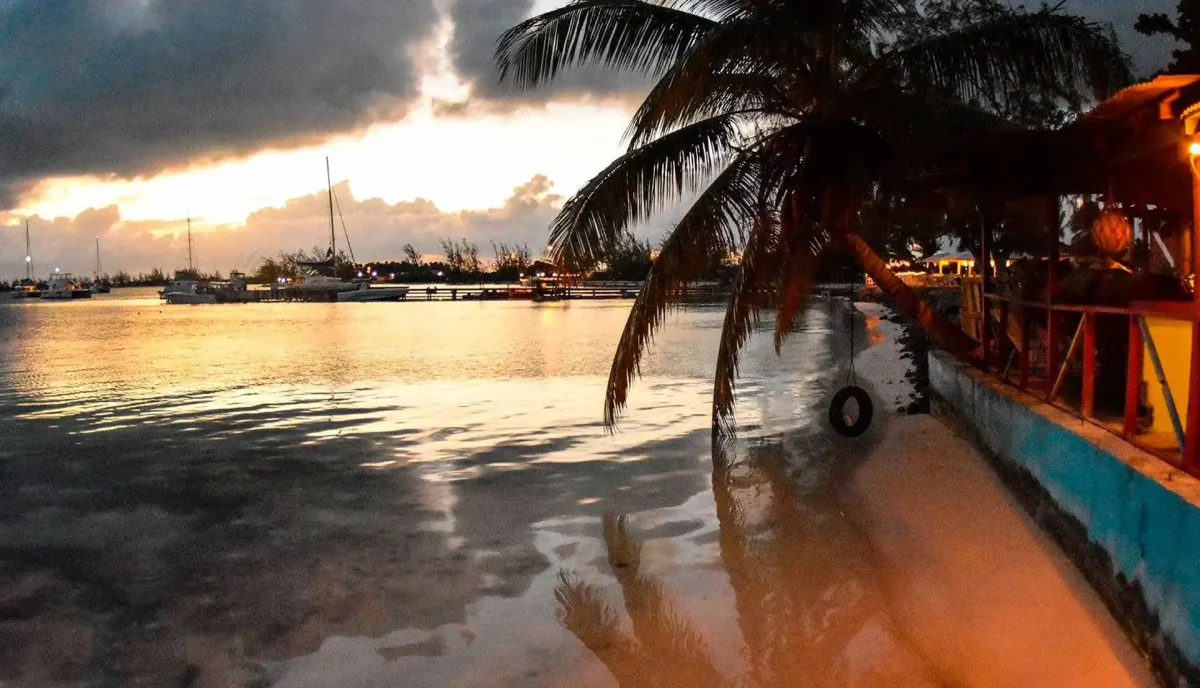 Potters restaurant at Anegada BVI at sunset with yachts at anchor reflected in calm water
