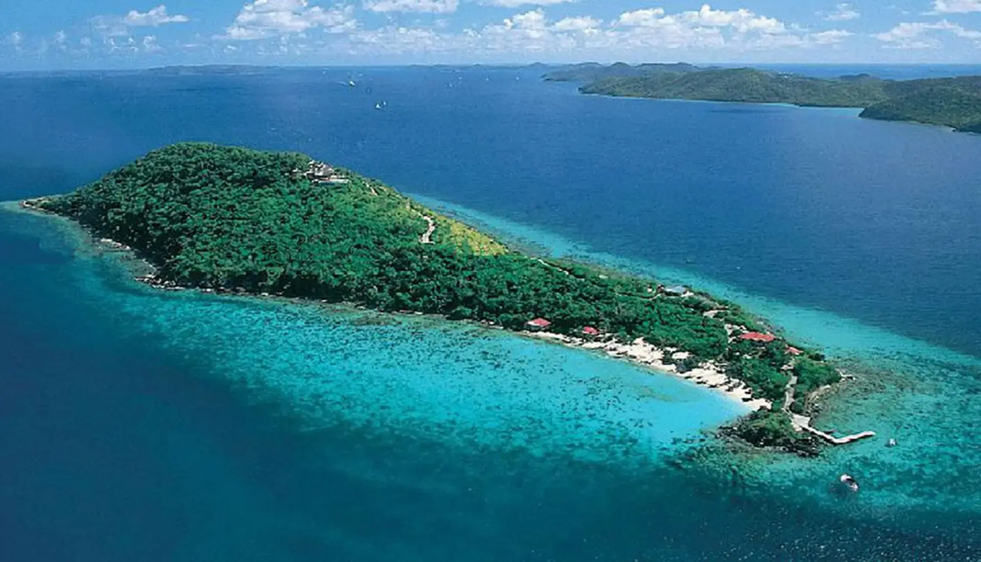 Aerial view of Little Thatch Island BVI showing the island's reef and surrounding Caribbean water