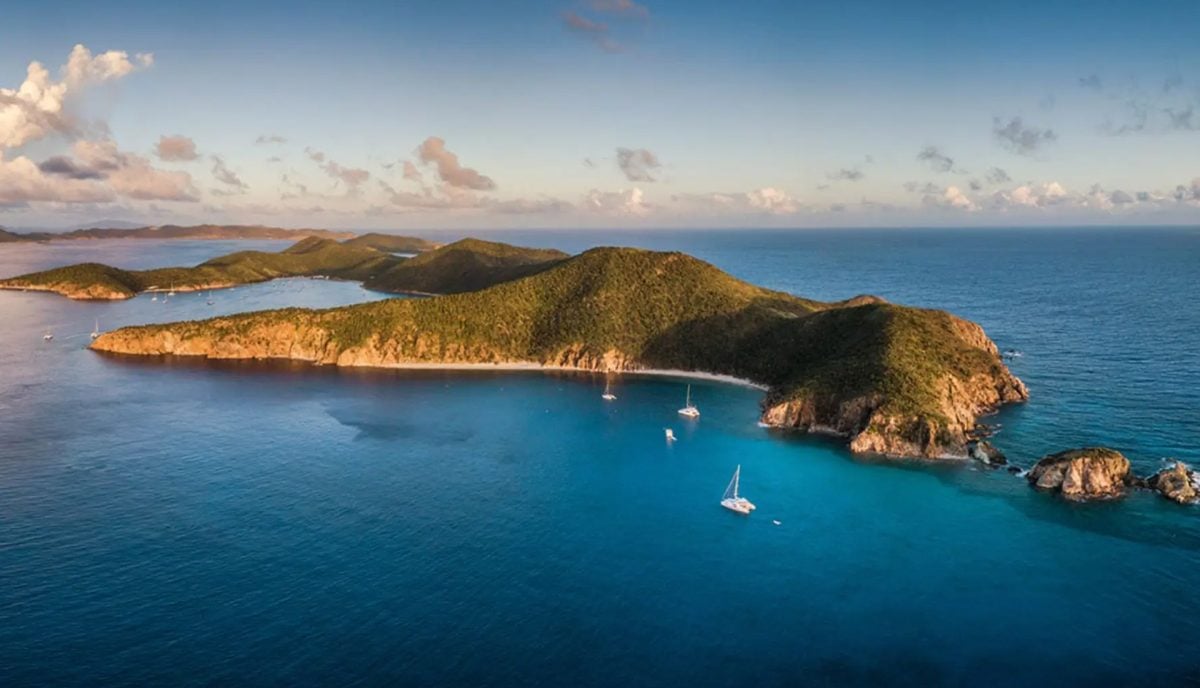 Aerial view of Norman Island BVI surrounded by turquoise water in the Sir Francis Drake Channel