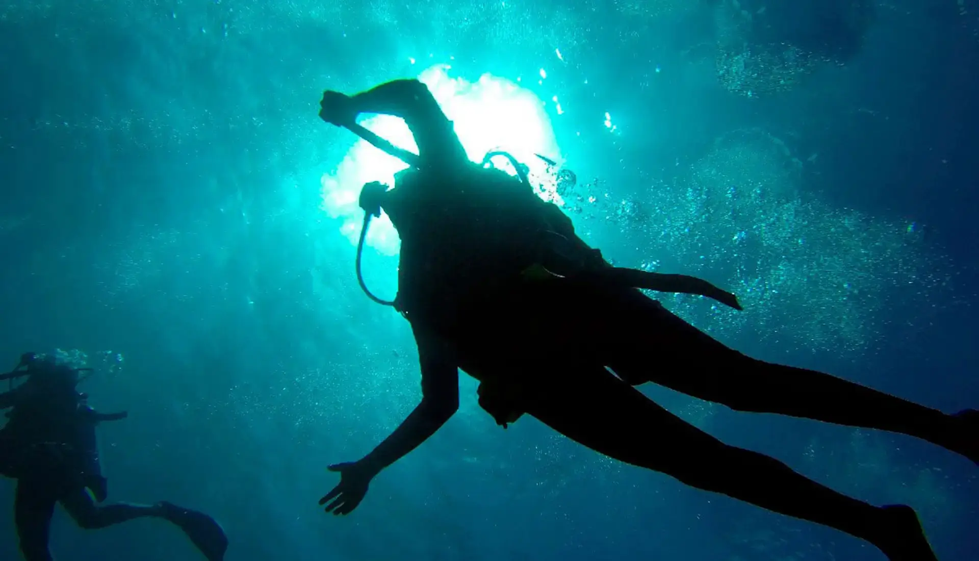 Scuba diver silhouette underwater on a BVI yacht charter