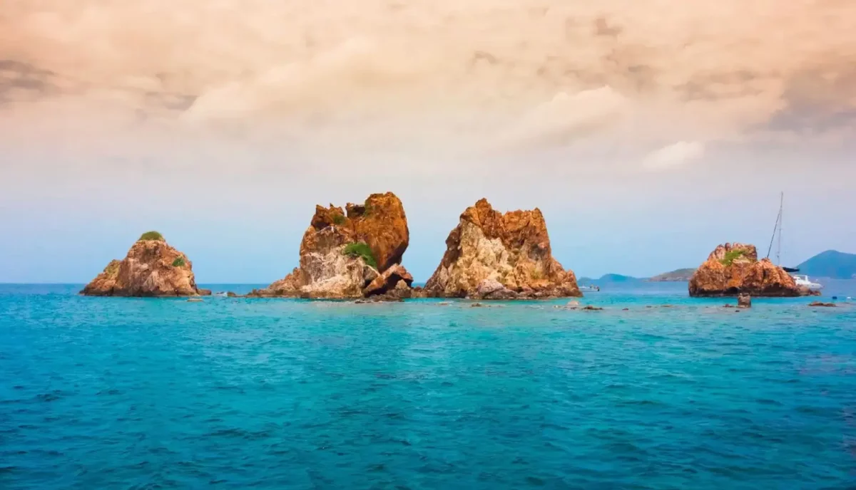 The Indians rock formations rising from turquoise water at Norman Island British Virgin Islands