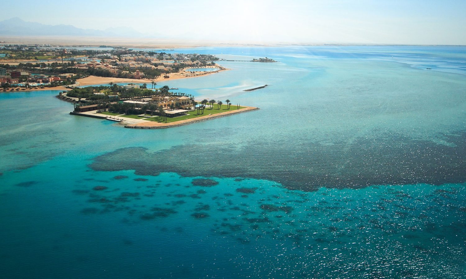 Aerial view of El Gouna resort town on Egypt's Red Sea coast with turquoise waterways and luxury yacht charter base