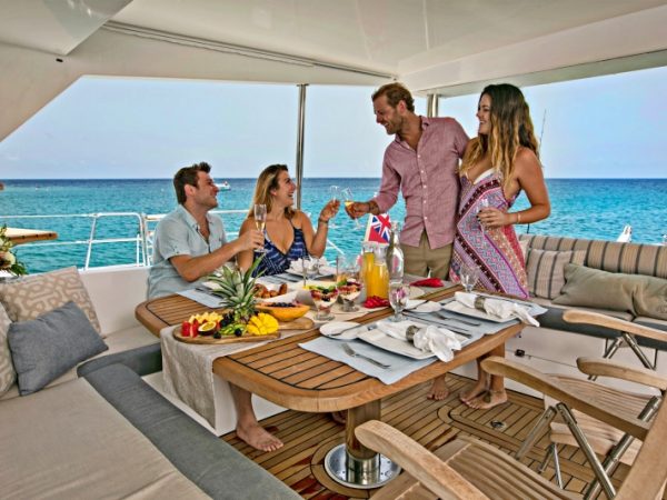 catamaran_anastasia_flybridge_dining_guests catamaran_anastasia_flybridge_dining_guests