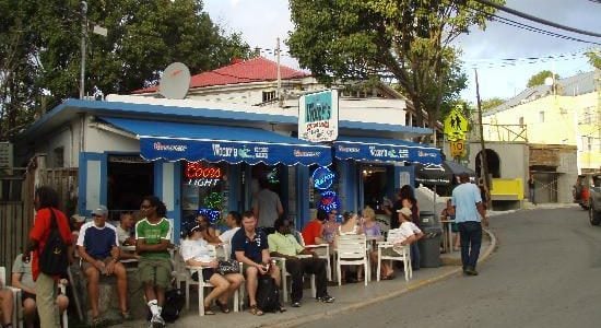One of the options from a sample USVI sailing itinerary is to stop at Woody's Seafood Bar in St. John.
